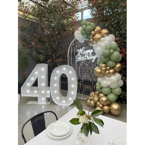 th Birthday Setup with Gold & White & Eucalyptus Balloon Garland